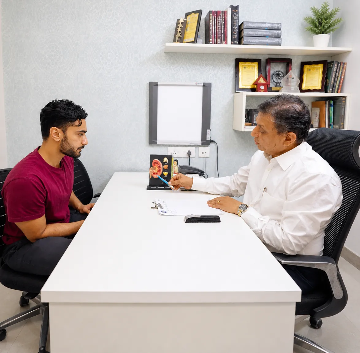 Dr. Anirudh Kaushik in consultation with a patient at urology clinic, South City 2, Gurgaon